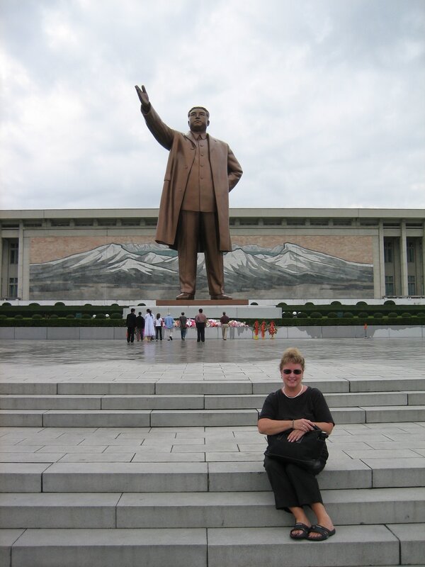 Woman at statue steps