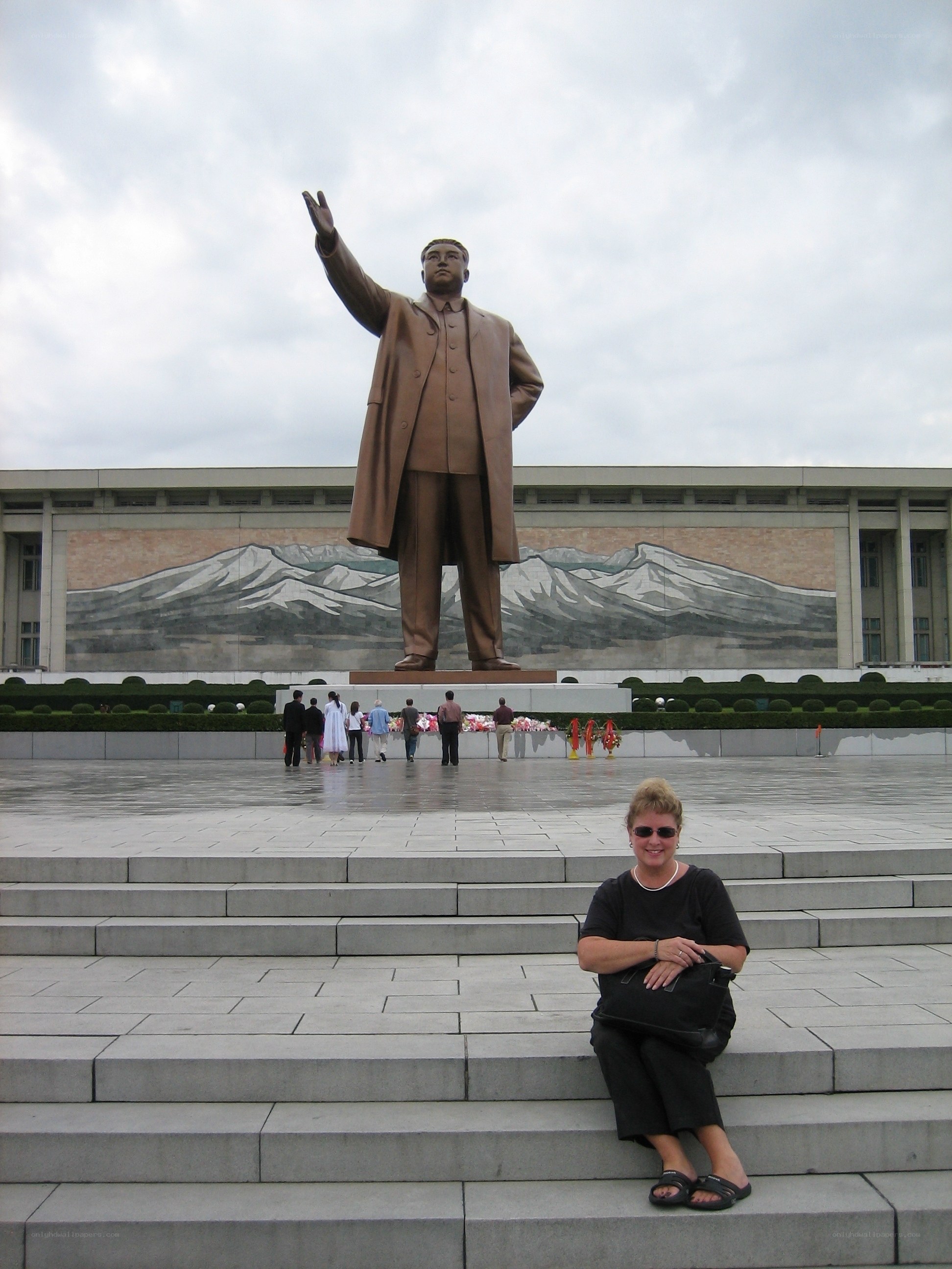 Woman at statue steps