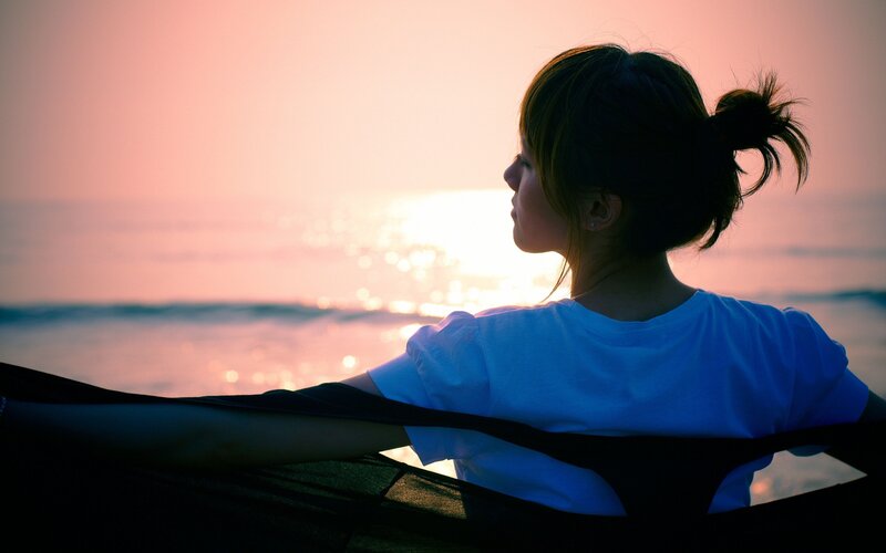 woman at sunset by the sea