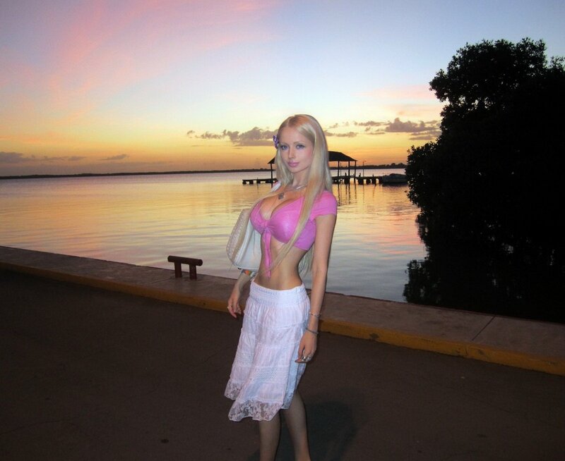 Woman at sunset by the water