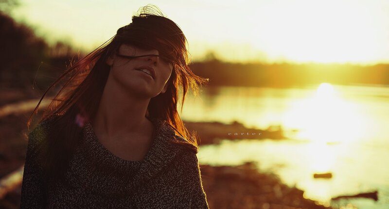 woman at sunset by water