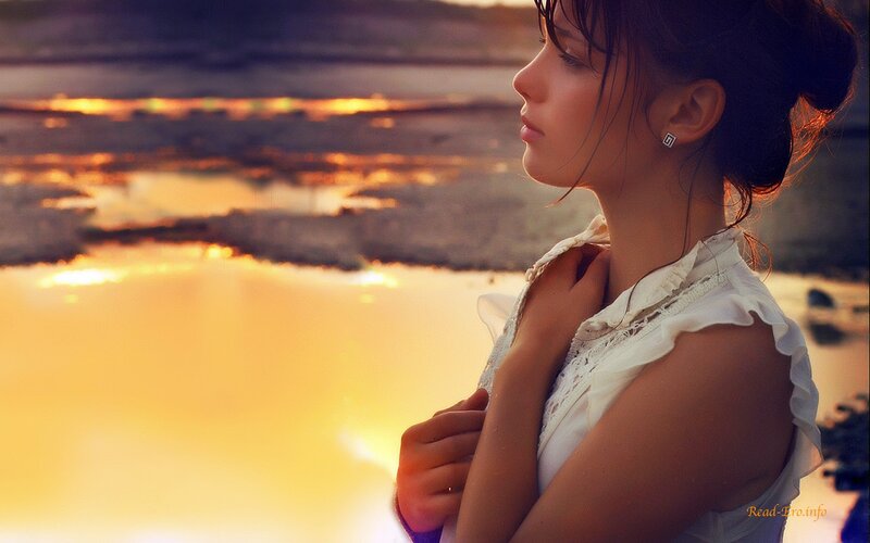 woman at sunset by water