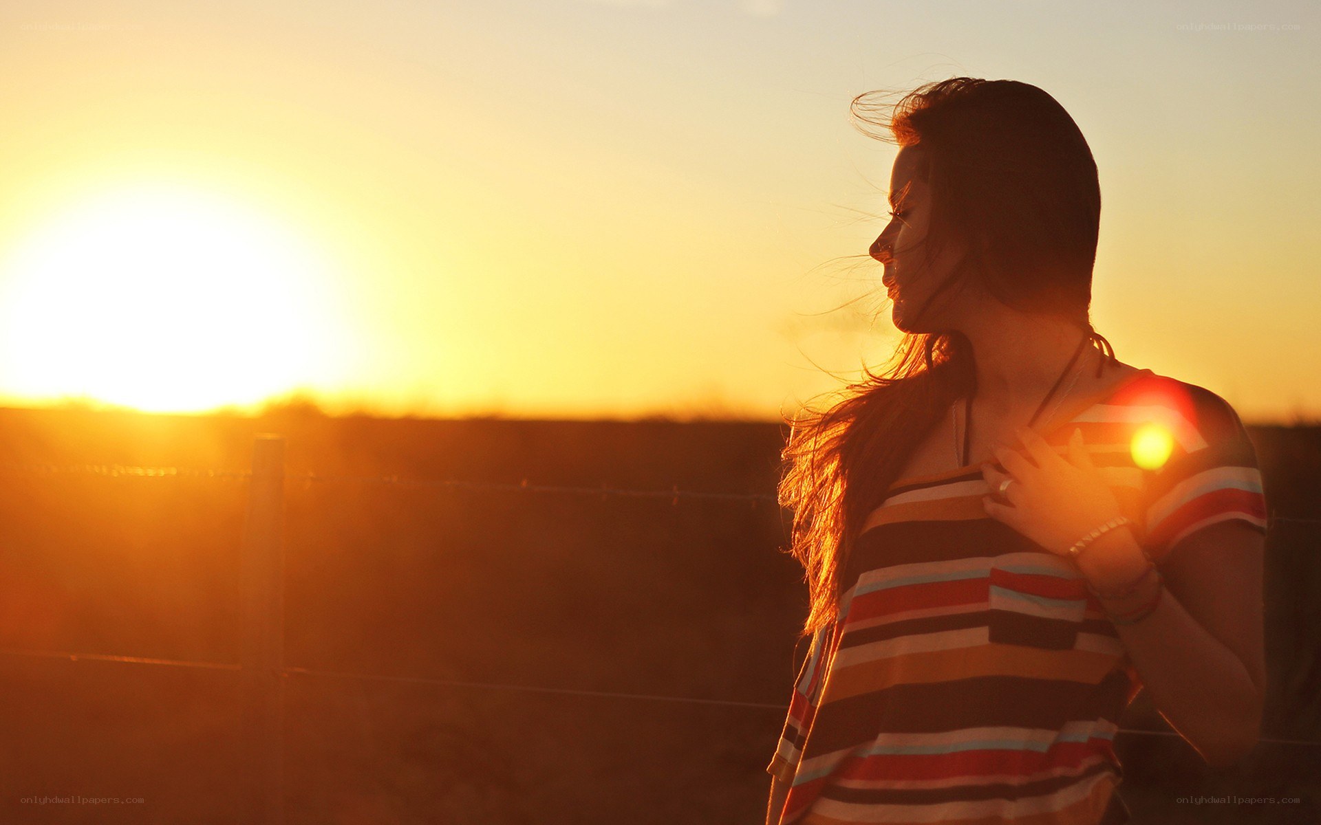 woman at sunset in field