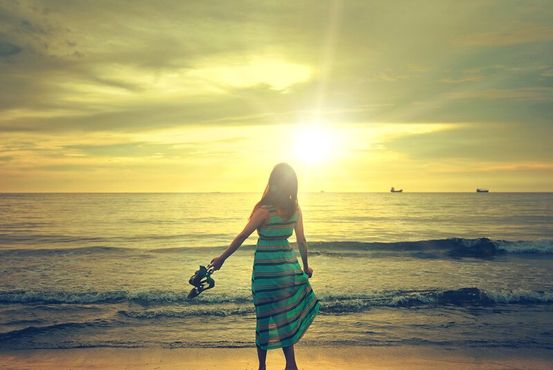 Woman at sunset on the beach