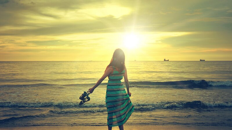 Woman at sunset on the beach