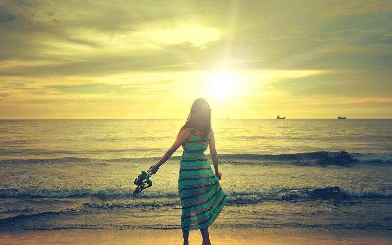 Woman at sunset on the beach