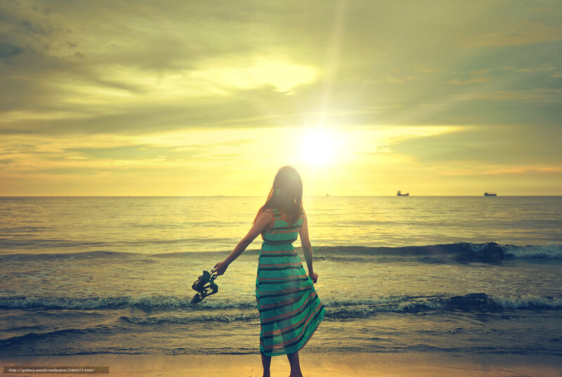 Woman at sunset on the beach