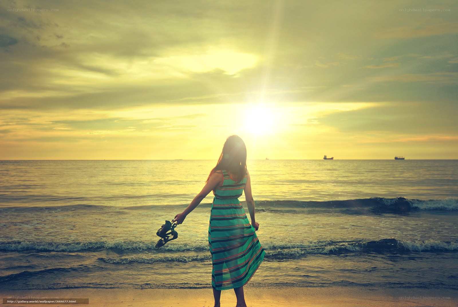 Woman at sunset on the beach