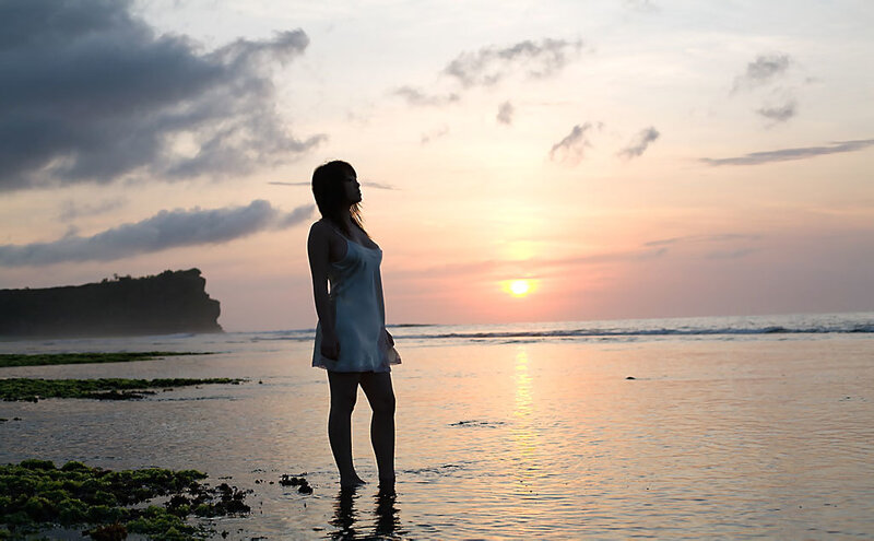 Woman at sunset on the beach