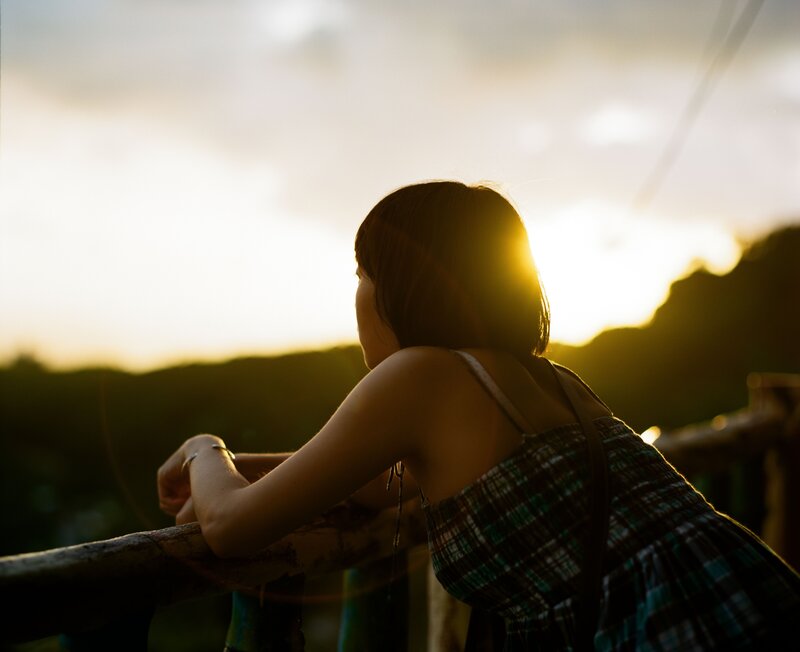 woman at sunset overlooking hills