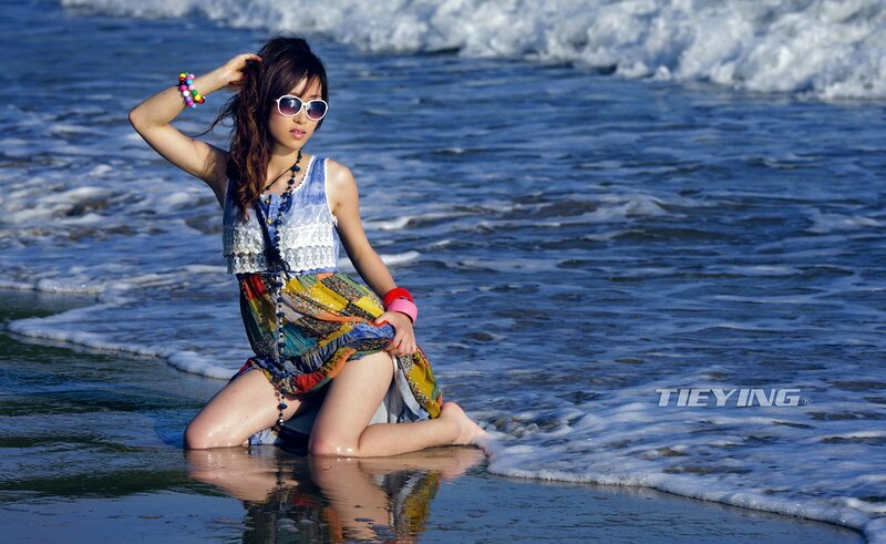 Woman at the beach in colorful dress