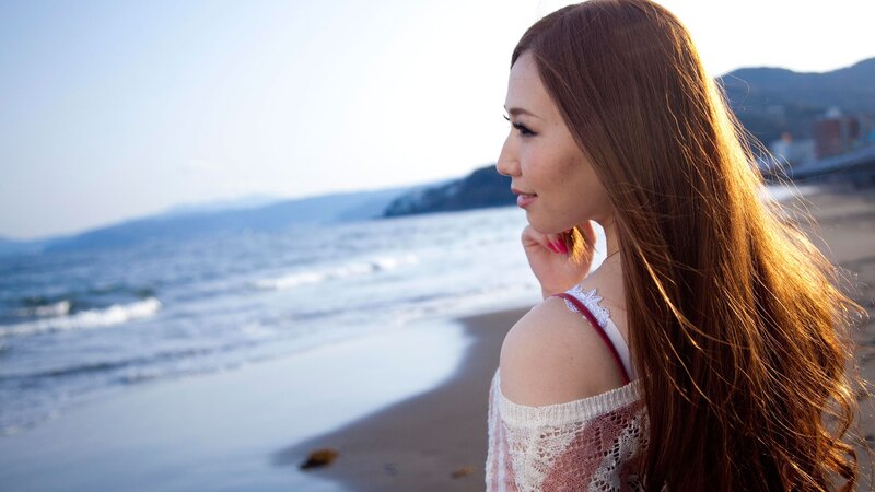 Woman at the beach in sunlight