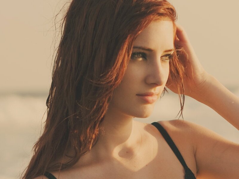 woman at the beach in sunset