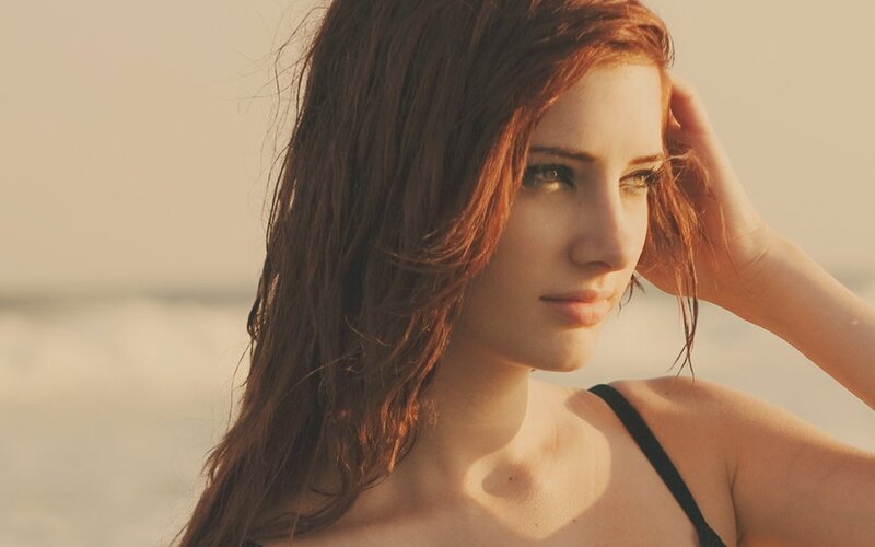 woman at the beach in sunset