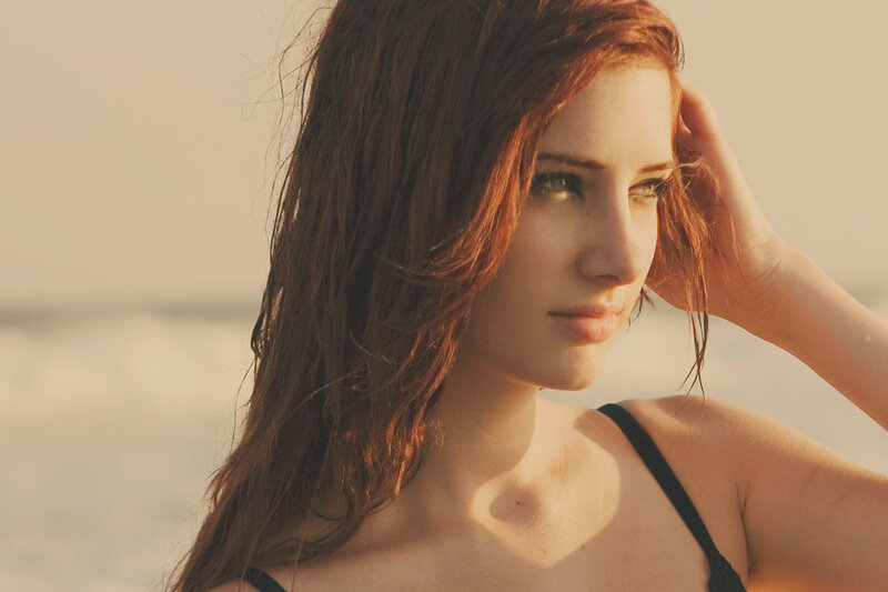 woman at the beach in sunset