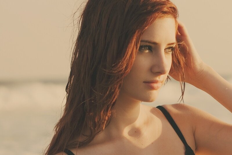 woman at the beach in sunset