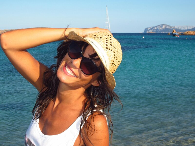 Woman at the beach smiling