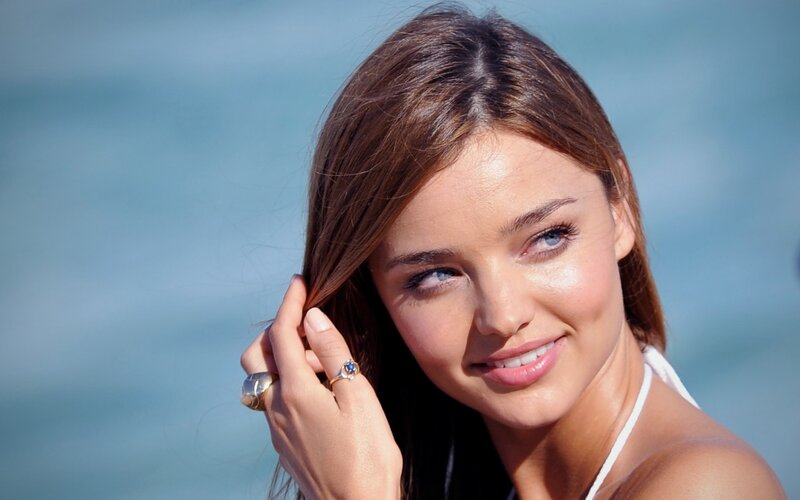 woman at the beach smiling