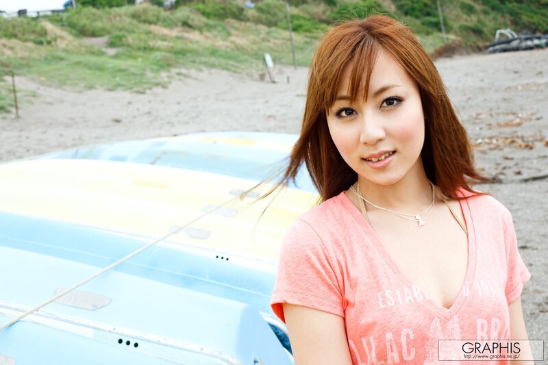 Woman at the beach with a boat