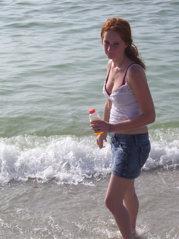 Woman at the beach with drink