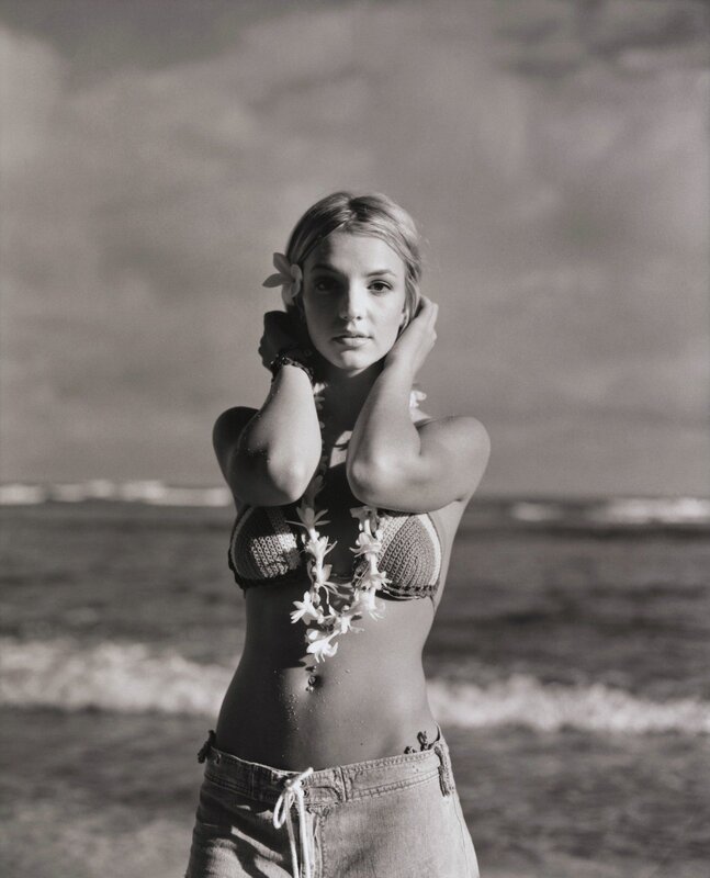 Woman at the beach with flowers