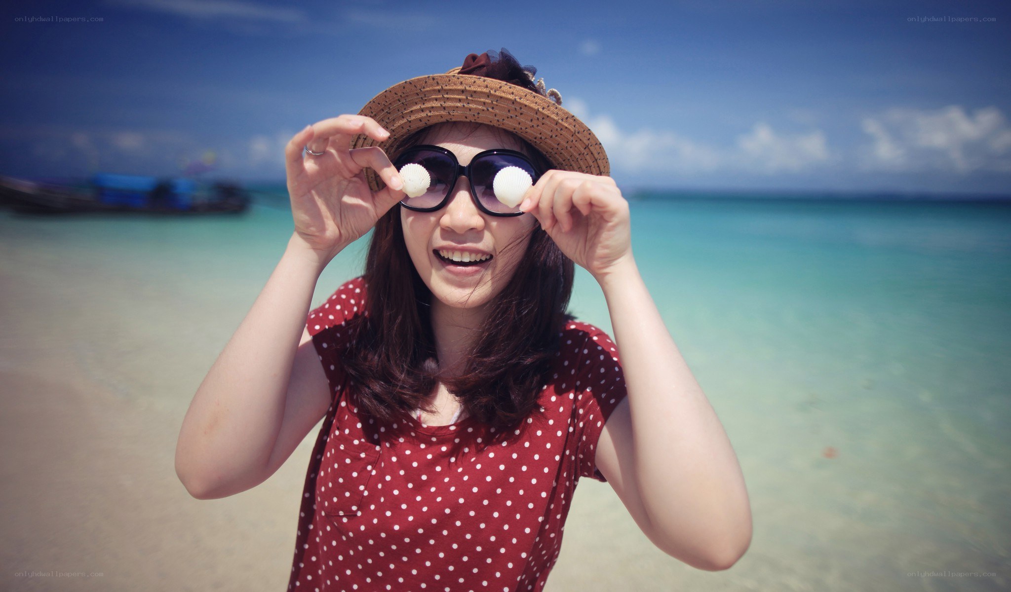 Woman at the beach with seashells