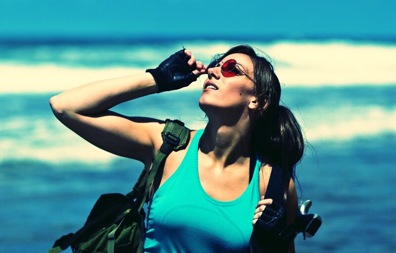 woman at the beach with sunglasses