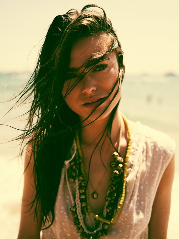 woman at the beach with wind-blown hair
