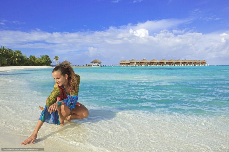 Woman at tropical beach resort