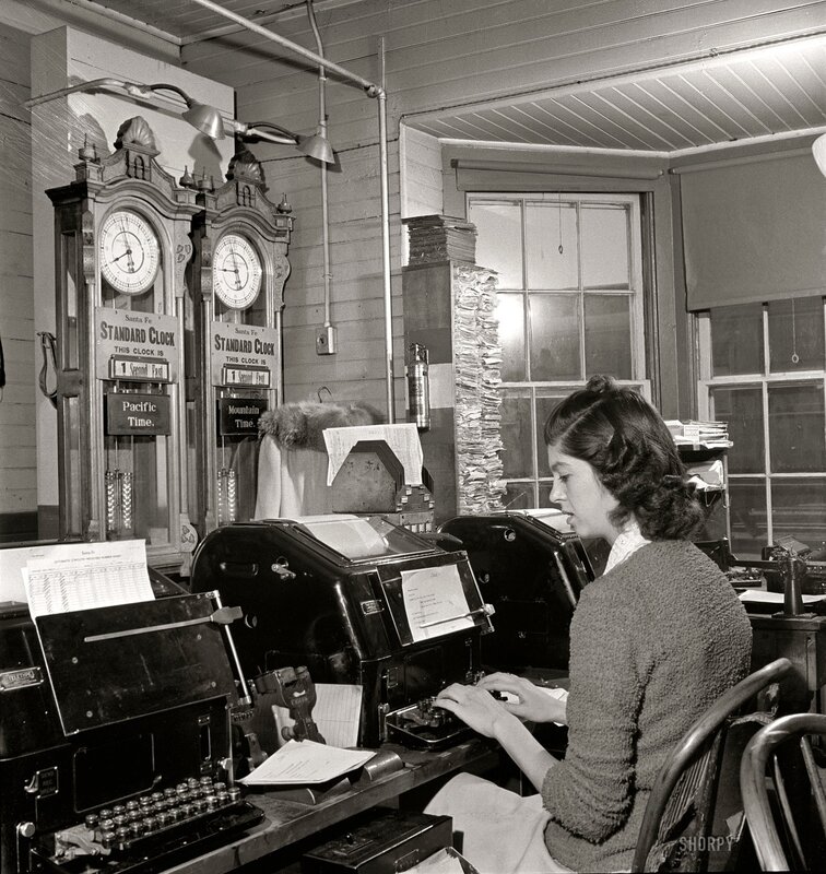 Woman at typewriter in office