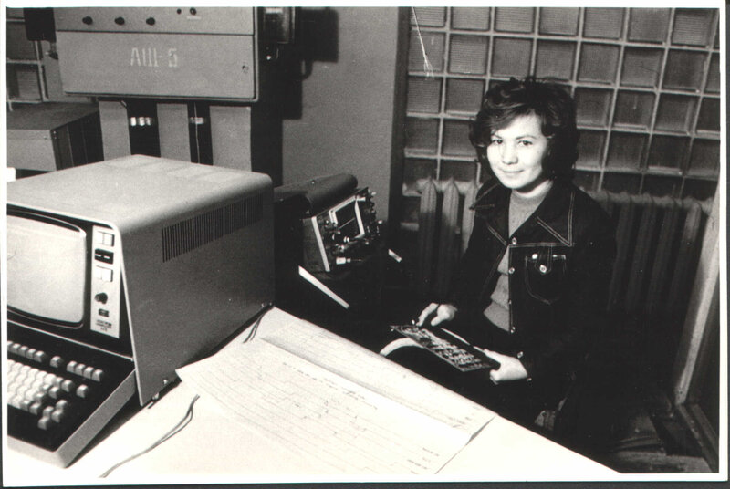 Woman at vintage computer station