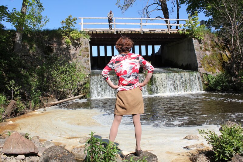 Woman at Waterfall — Red