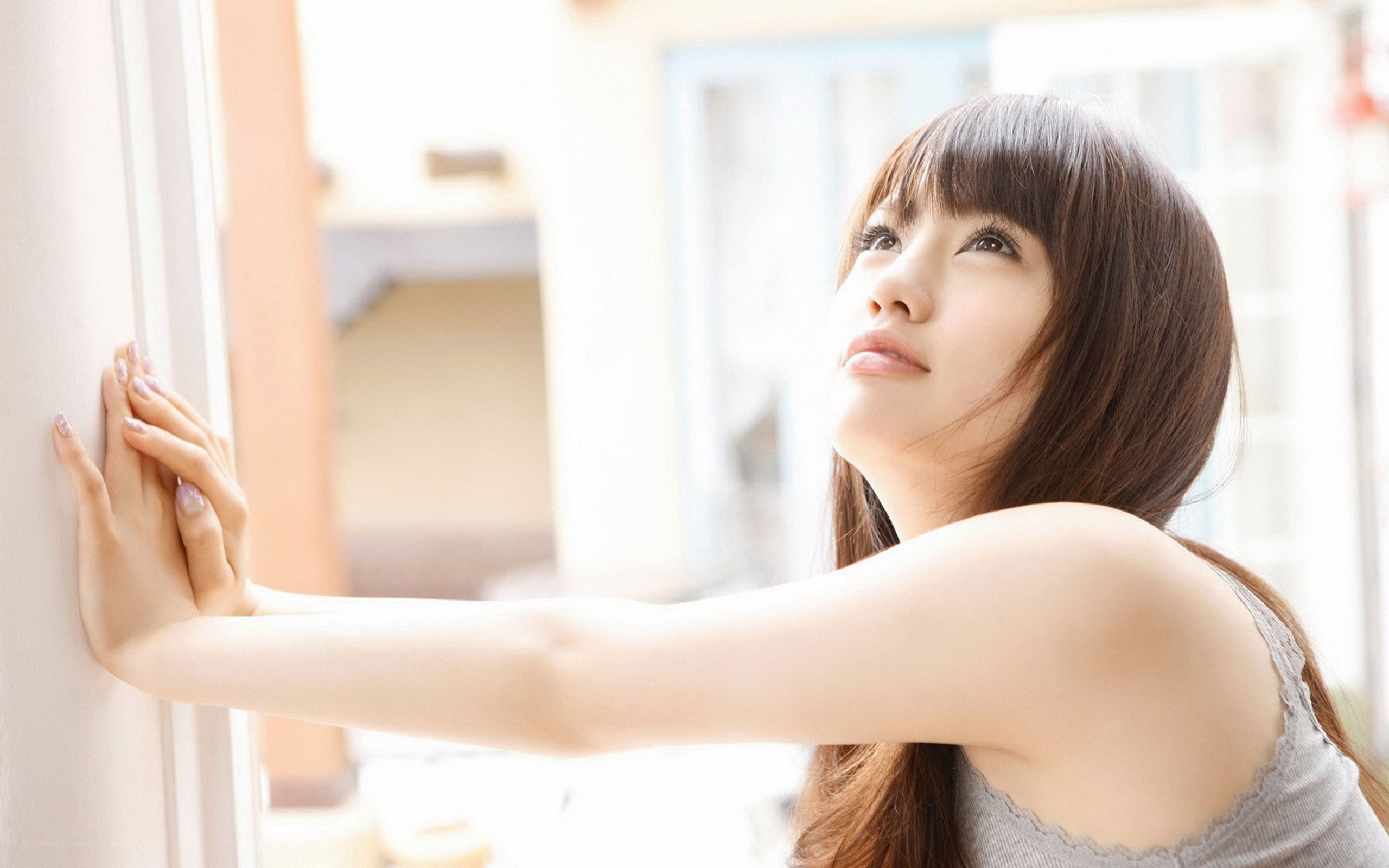 woman at window in sunlight
