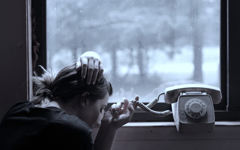 Woman at Window with Phone — Gray