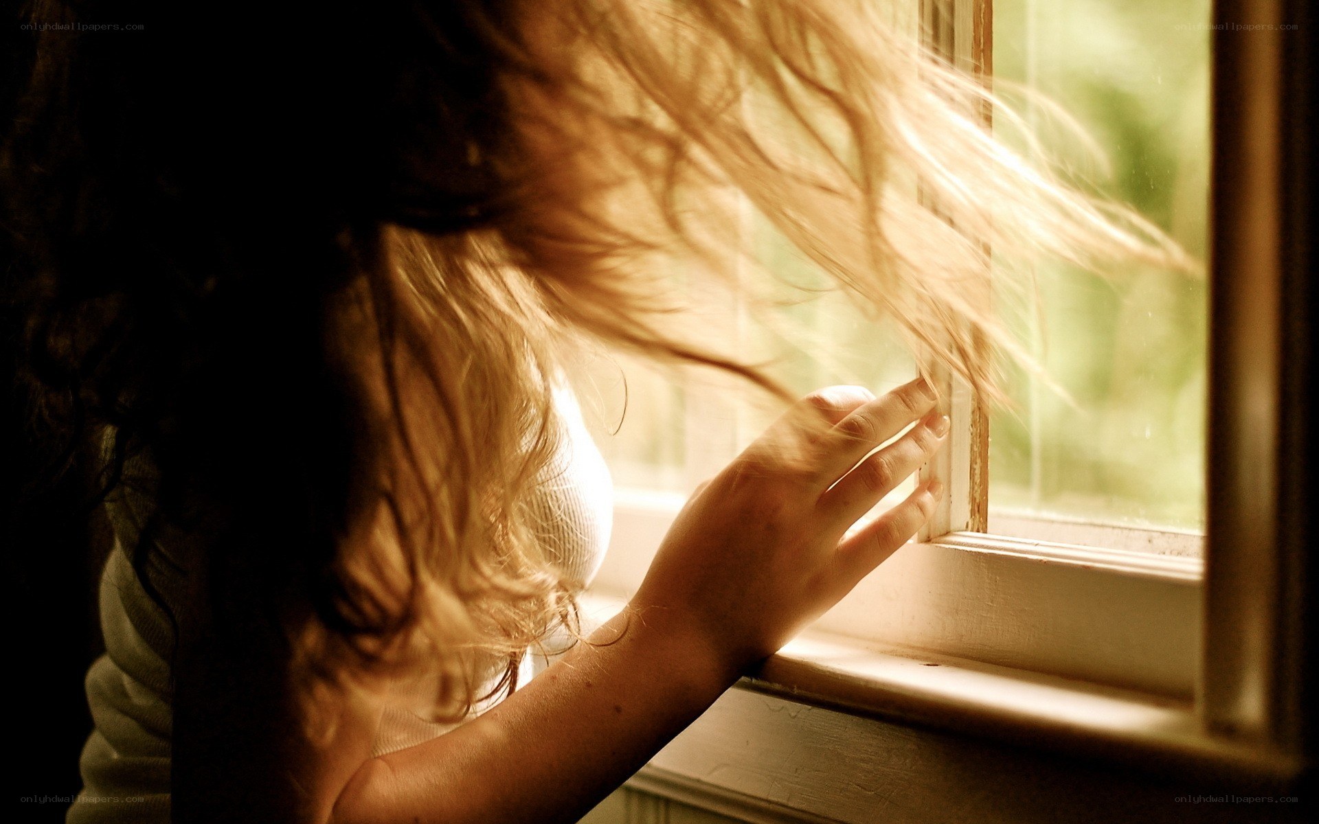 woman at window with sunlight