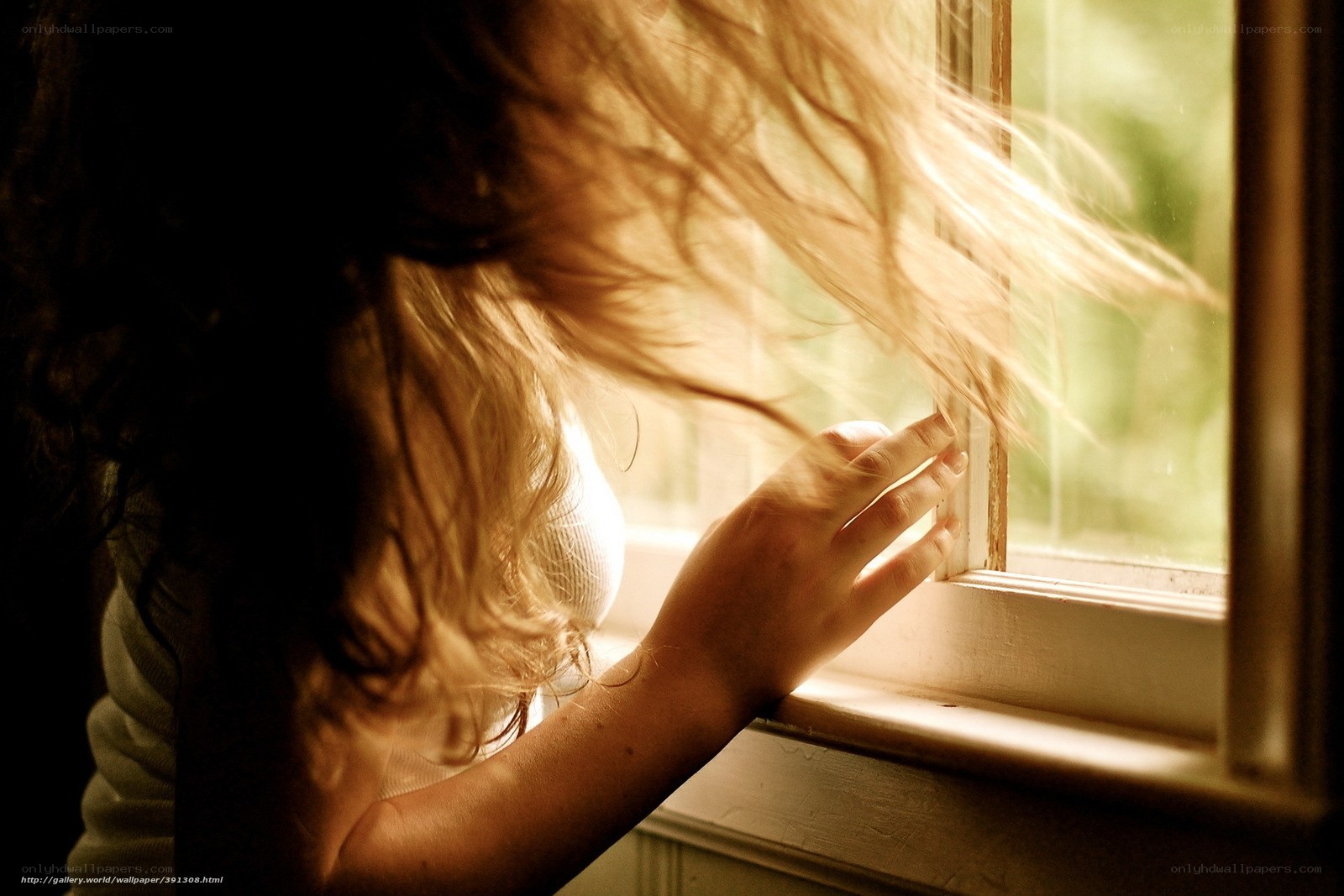 woman at window with sunlight