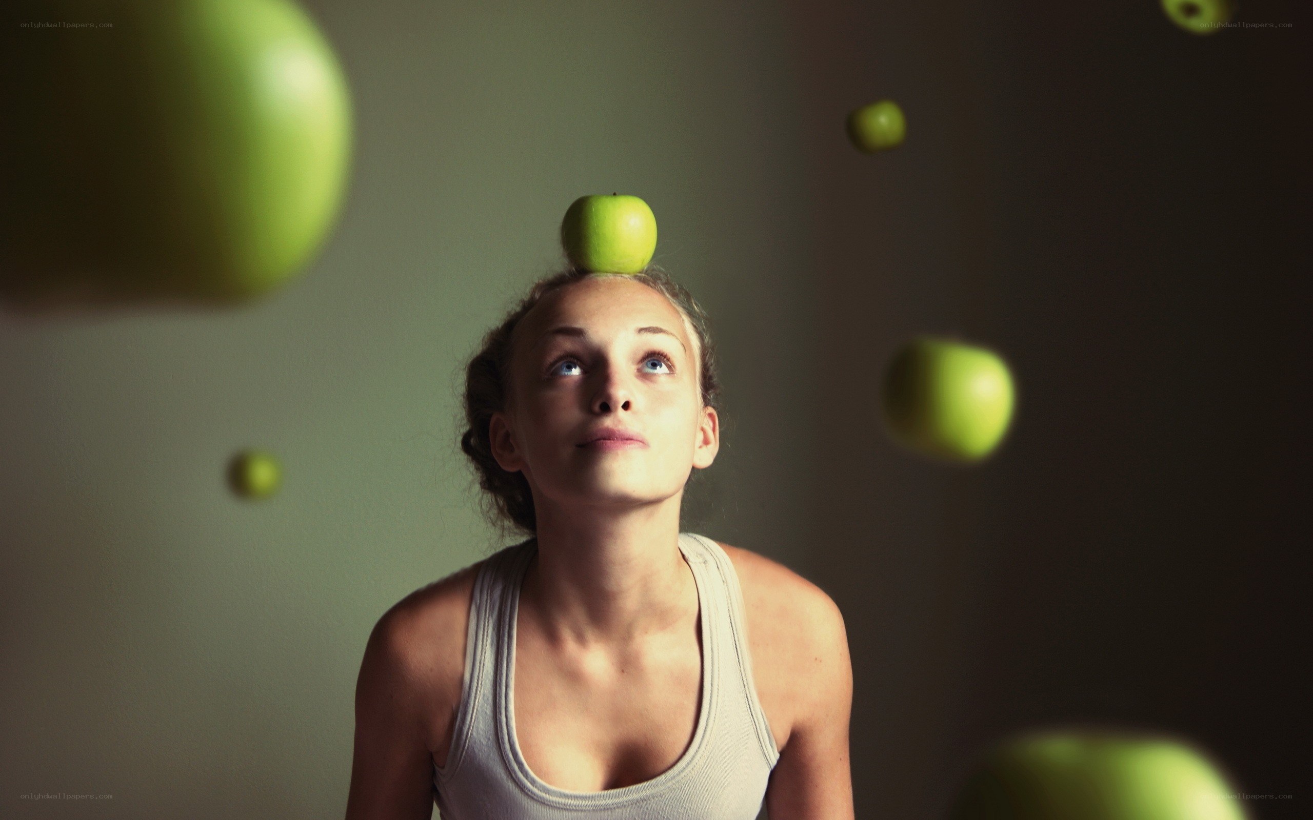 woman balancing apple on head