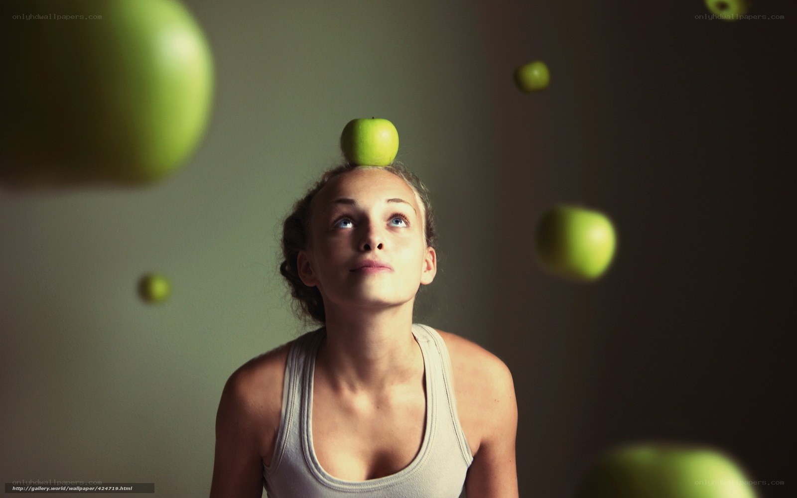 woman balancing apple on head