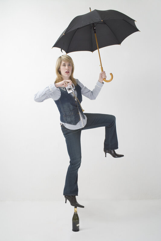 Woman balancing on a bottle