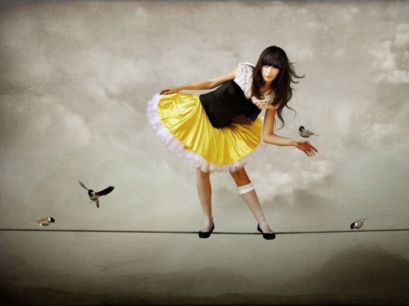 Woman balancing on a tightrope