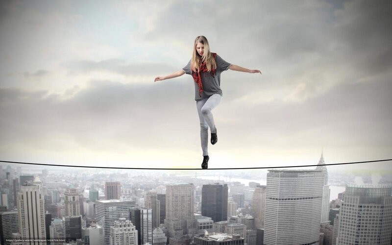 Woman balancing on tightrope