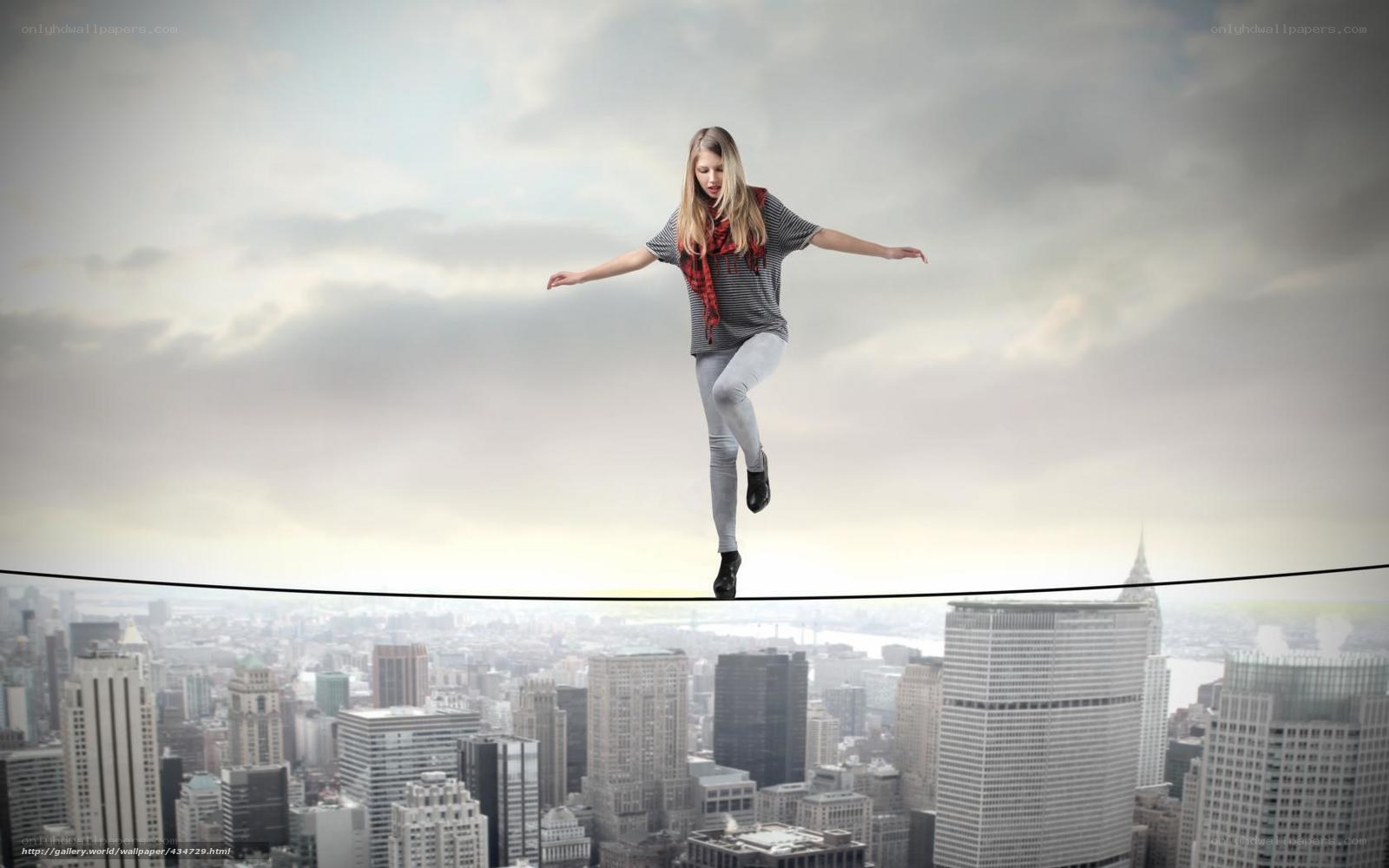 Woman balancing on tightrope