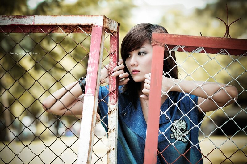 woman behind a fence