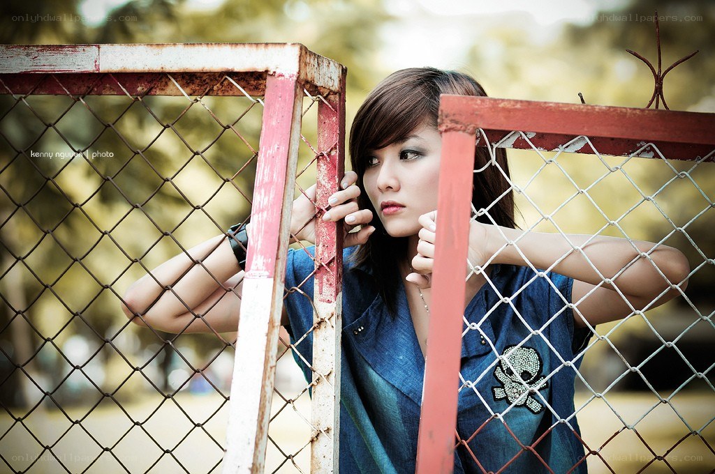 woman behind a fence