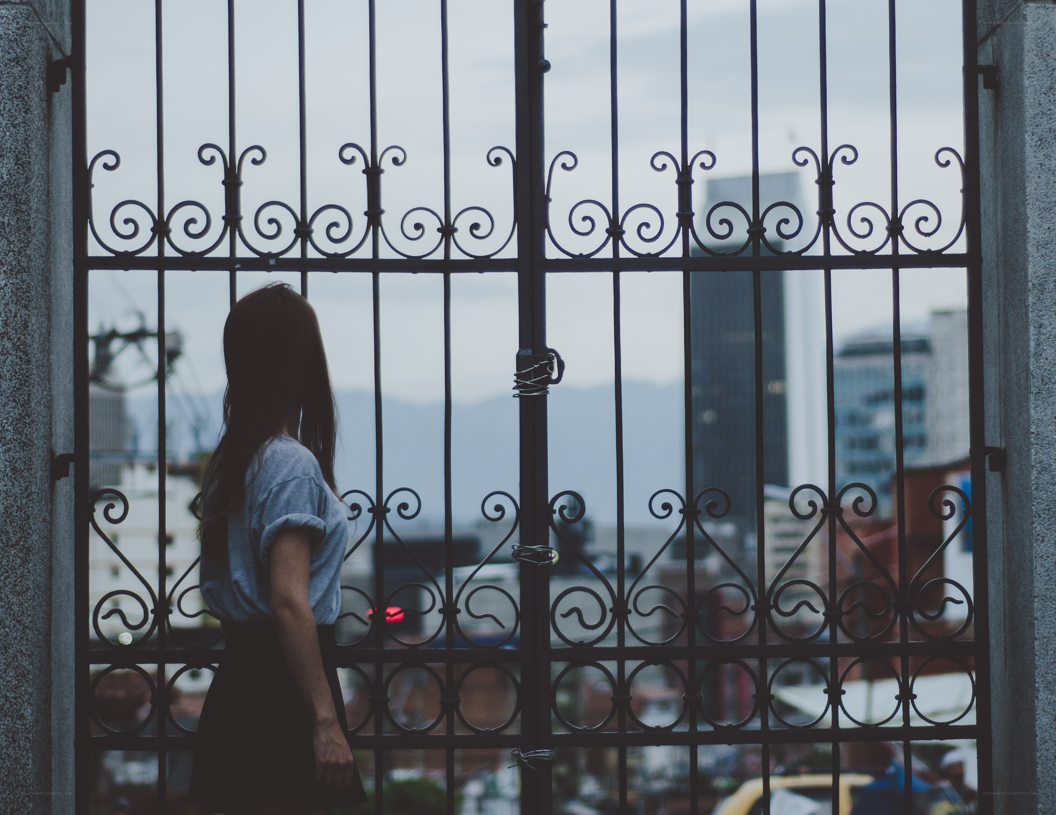woman behind a gate