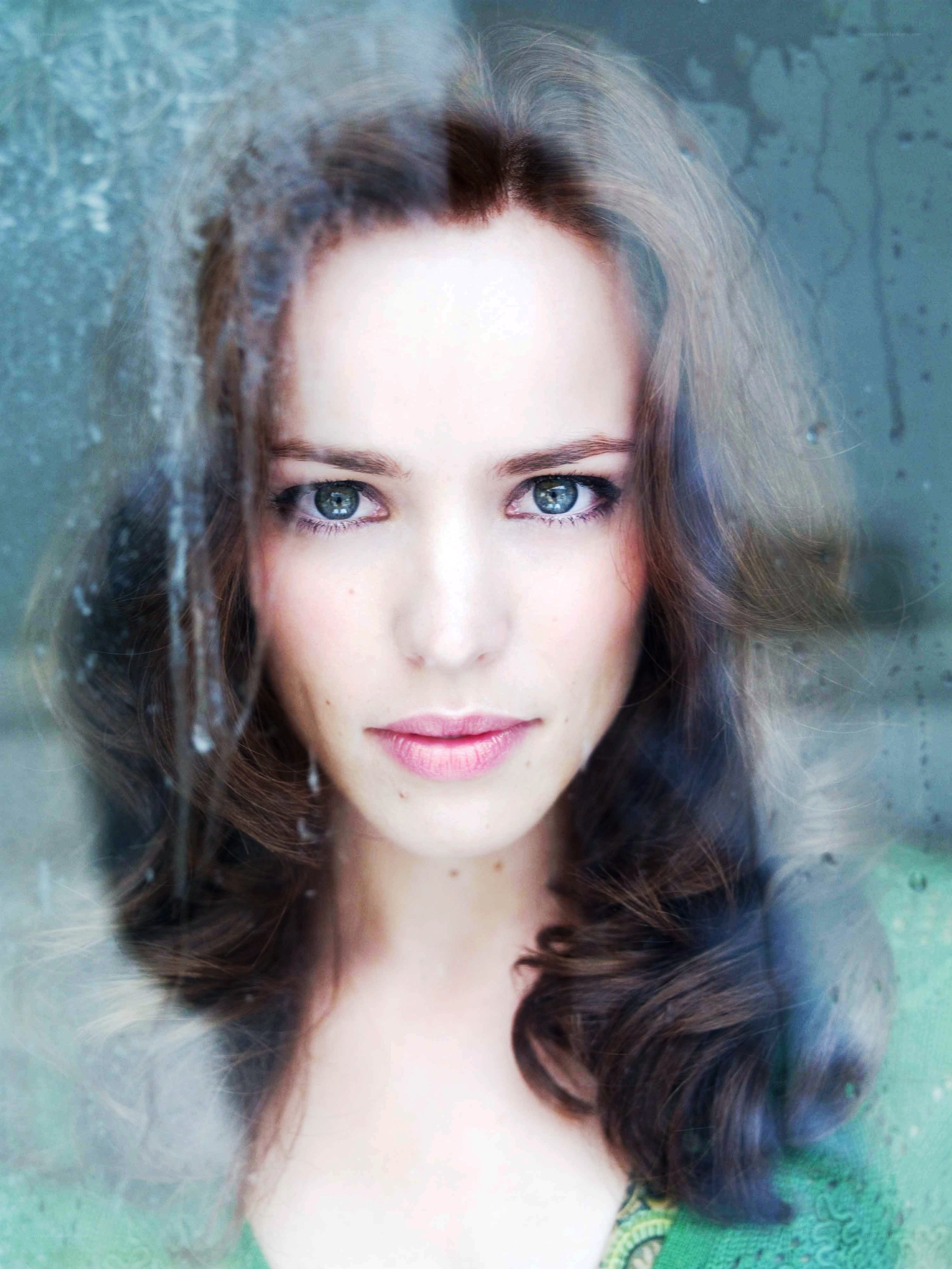 woman behind a wet window