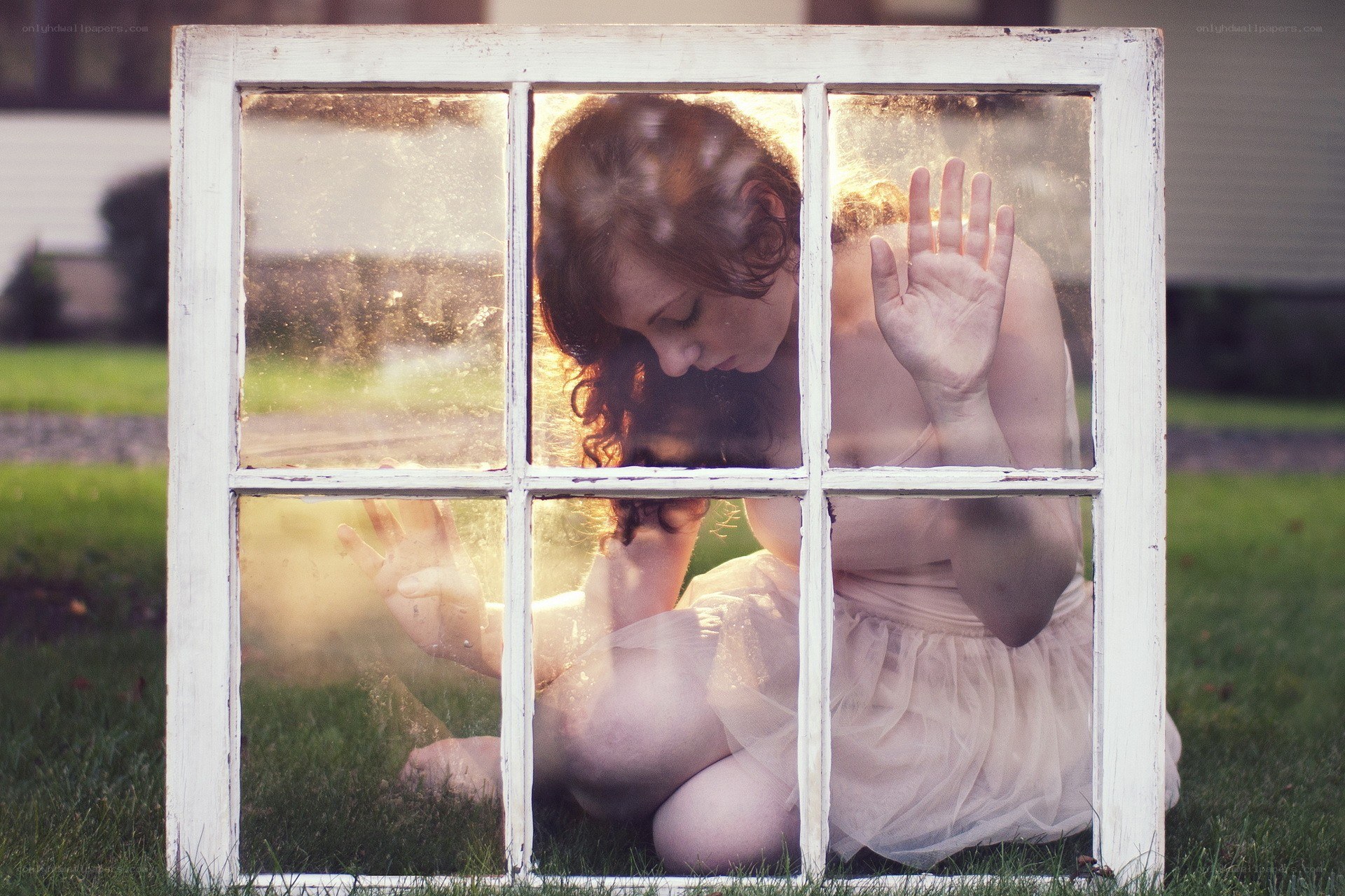 woman behind a window frame