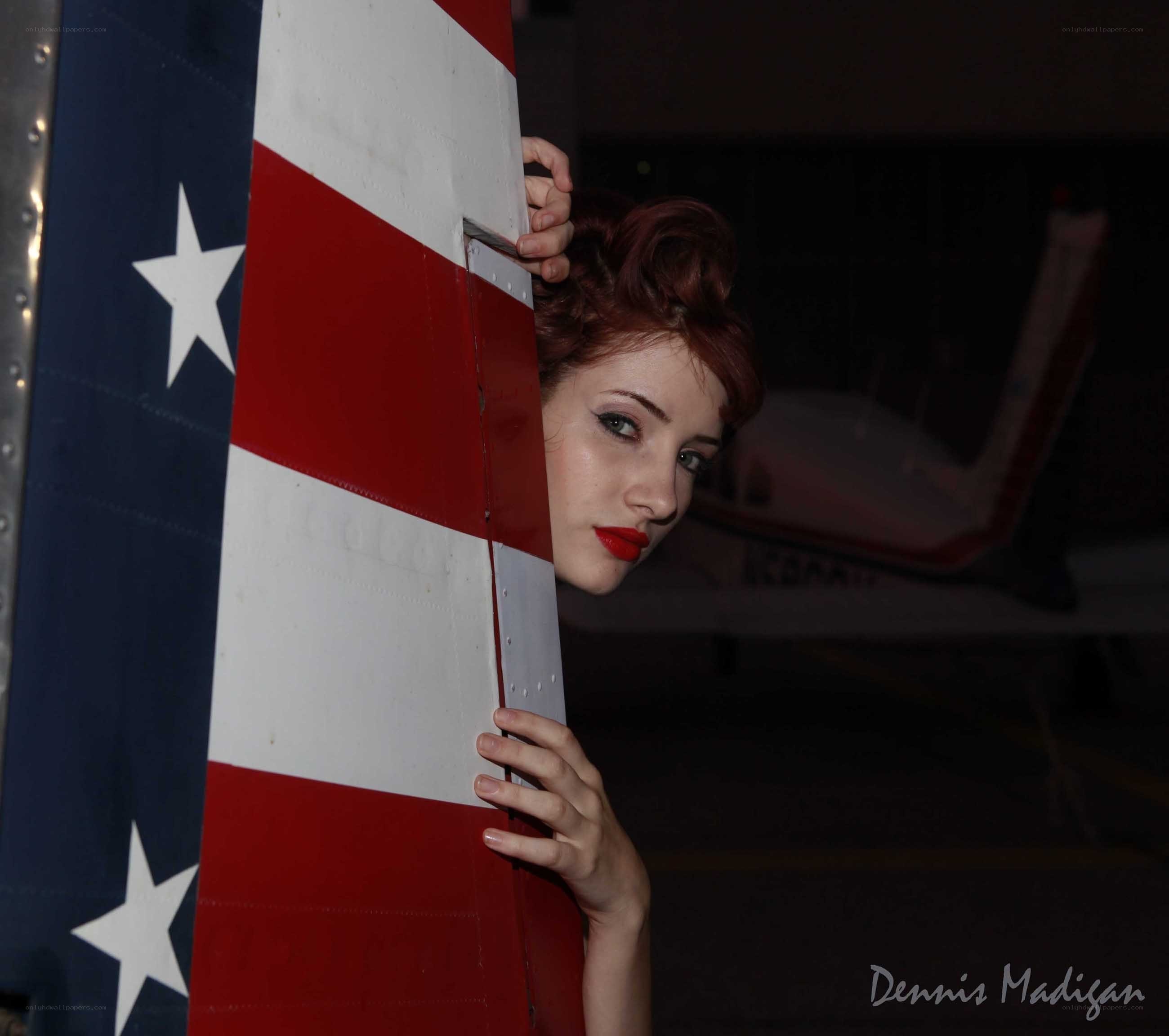 woman behind airplane tail