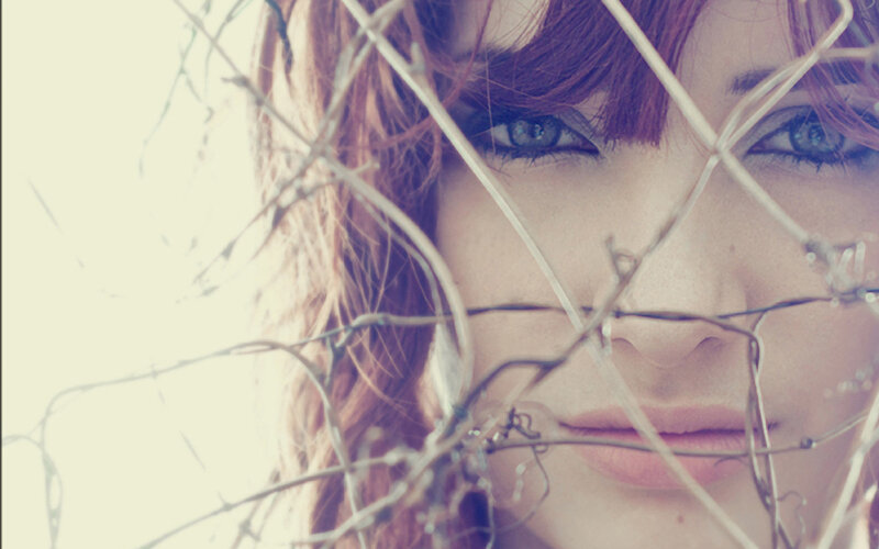 woman behind barbed wire