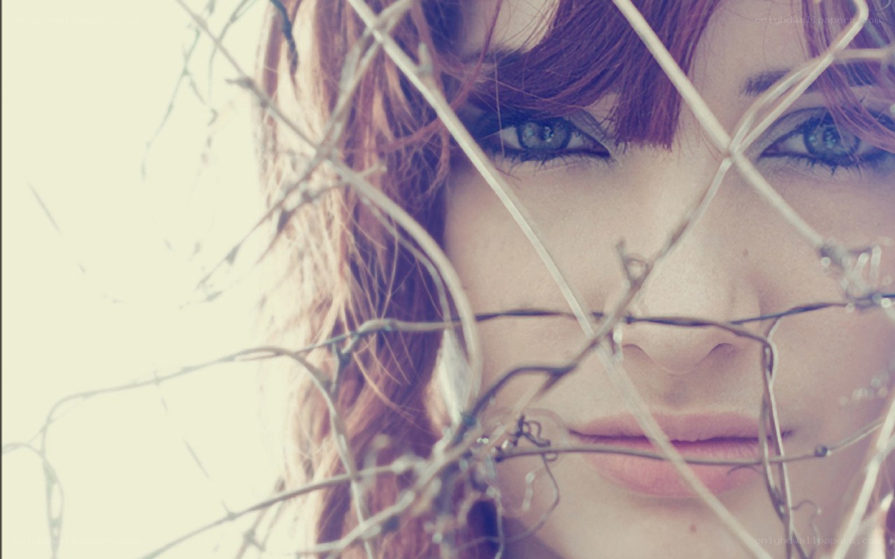 woman behind barbed wire